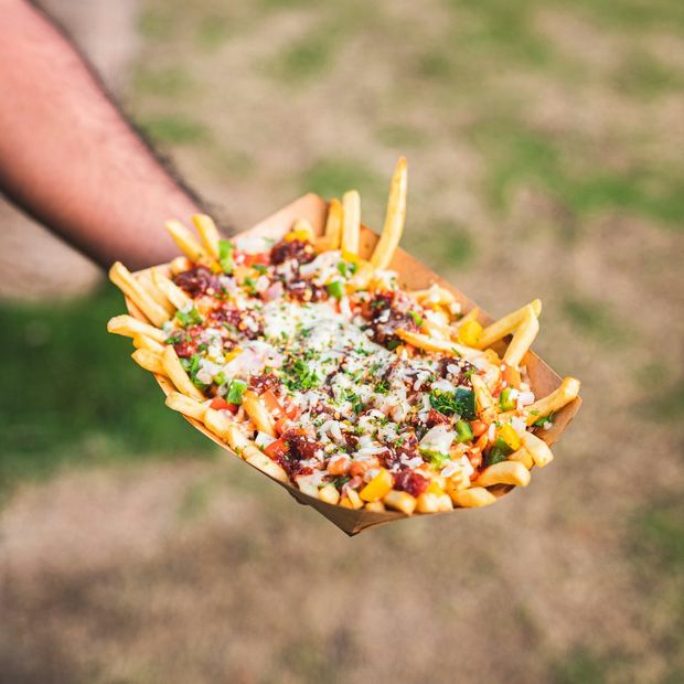 Loaded fries with cheese and herbs